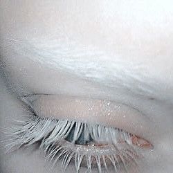 the eye of a woman with long eyelashes