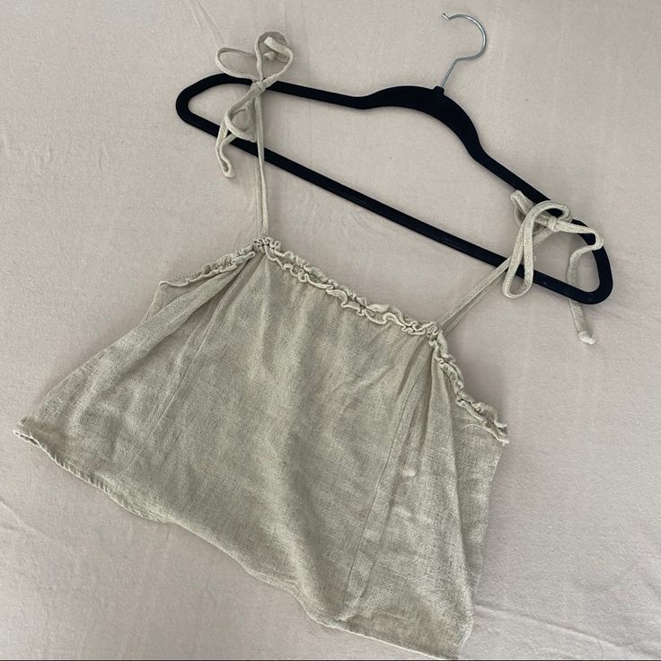 This Is A Super Cute Nwot Beige Colored Crop Top From Pacsun Brand Lottie Moss. It’s A Size Small. Excellent Condition As It Has Never Been Worn! It Has A Boxier Fit And A Cute Ruffle Detailed Top. It’s A Linen Blend Fabric. Open To Offers! Adjustable Strap Tops For Beach Season, Adjustable Strap Tops For Beach Season Day Out, Adjustable Straps Tops For Beach Season Day Out, Cropped Tops With Tie Straps For Vacation, Beige Linen Crop Top For Beach, Cropped Linen Tops For Brunch, Beach Crop Top With Tie Straps, Spring Beach Linen Crop Top, Summer Beige Tops For Daytime