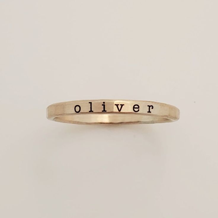 Add a touch of individuality to your jewelry collection with the Typewriter Name Ring from Going Golden. Handcrafted in Brownsburg, Indiana, this ring is perfect for those who love a classic, typewriter-style font. Available in 14K gold-filled, fine silver, or rose gold, this ring offers 100x more solid gold than plated alternatives, ensuring it’s waterproof and tarnish-resistant. Each ring comes with a polishing pad and a gift box, making it a thoughtful gift for someone special or a delightful Everyday Gold Hand Stamped Stackable Rings, Hand Stamped 14k Gold Engraved Ring, Hand Stamped 14k Gold Ring, Hand Stamped 14k Yellow Gold Engraved Ring, 14k Yellow Gold Hand Stamped Engraved Ring, 14k Yellow Gold Engraved Ring With Hand Stamped Details, Gold Engraved Tarnish-resistant Sterling Silver Ring, Classic Rose Gold Engraved Stackable Ring, Adjustable 14k Gold Hand-stamped Rings