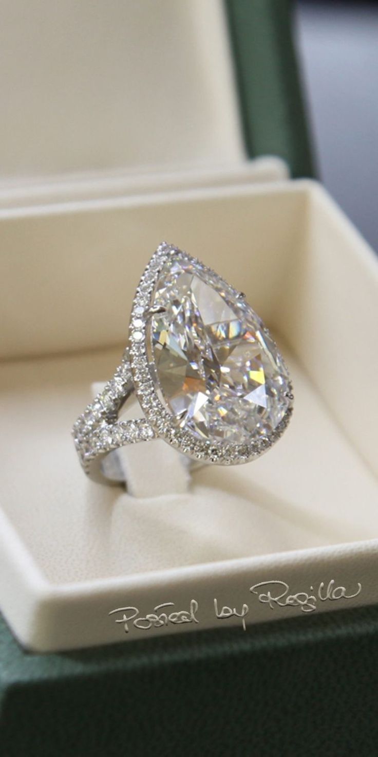 a diamond ring sitting in a box on top of a table