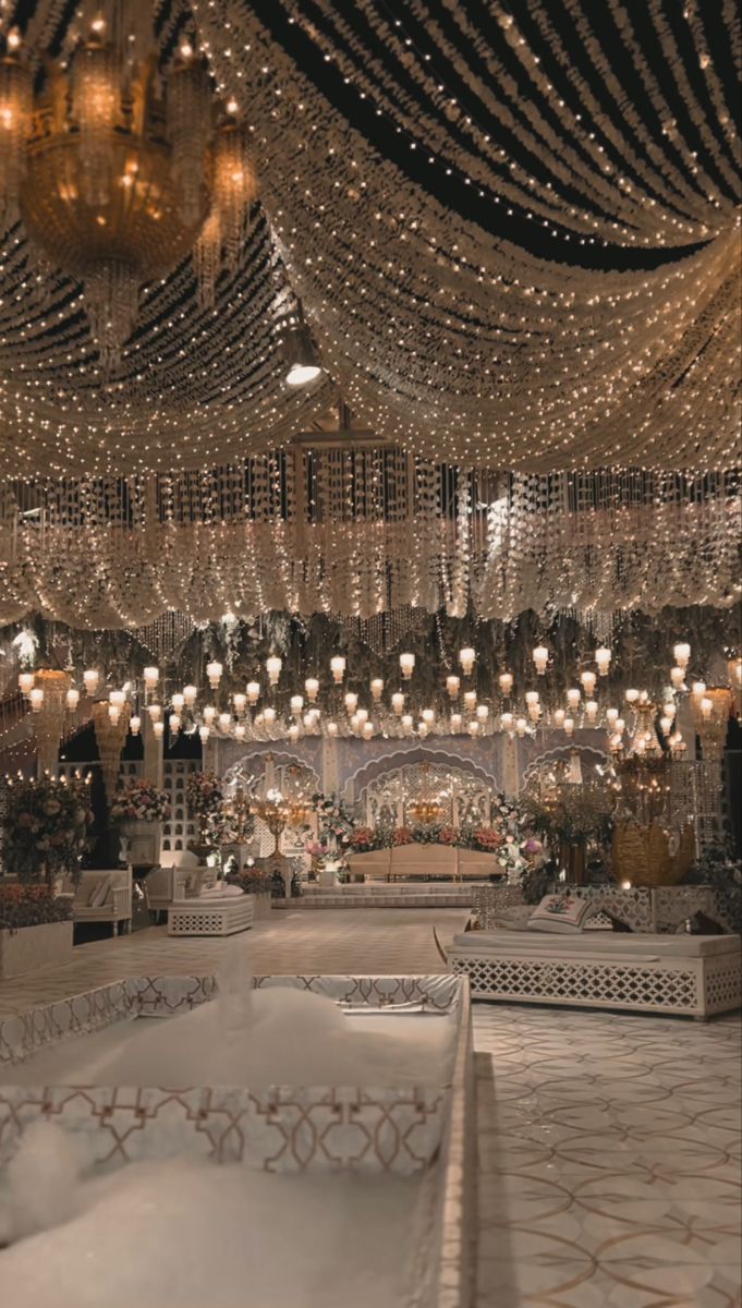 an elaborately decorated room with chandeliers and lights