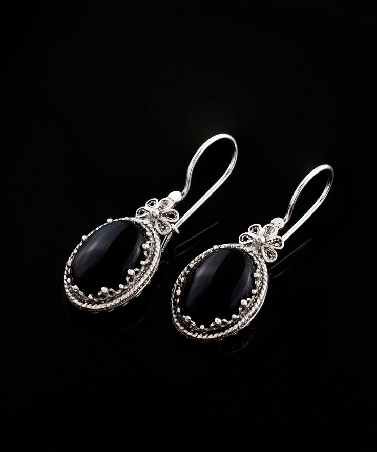 Black Onyx Silver Gothic Dangle Earrings, Victorian Drop Earrings 925 Sterling Silver Artisan Handmade Filigree Woman Jewelry,Handmade Earrings, Birthday gift, Anniversary gift, silver gift for mom Gemstone: Black Onyx 10x14mm. Material: 925 Sterling Silver ( NICKEL FREE ) Length and Width: 3.6cm X 1.4cm // 1.4 Inches X 0.55 Inches These black oval stone earrings add a bold fashion statement to any look. The handcrafted designs that make a beautiful fashion statement in that cocktail earrings. This vintage, original, and stylish luxury jewelry is perfect for wearing at parties, festivals and everyday life. FAST AND TRACKABLE SHIPPING FOR ALL EU COUNTRIES AND USA. COMES WİTH VELVET POUCH AND LUXURY GİFT BOX. This earrings, is timeless, and elegant jewelry piece is the perfect gift for Mothe Silver And Black Earrings, Black Hallmarked Drop Earrings, Black Filigree Earrings As Gift, Black Filigree Earrings For Gift, Ornate Oval Sterling Silver Earrings, Traditional Black Sterling Silver Earrings, Black Oval Handmade Earrings, Handmade Sterling Silver Earrings For Formal Occasions, Handmade Black Earrings For Anniversary