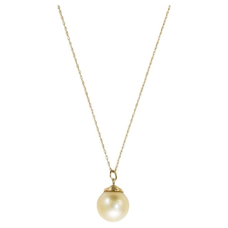 14k yellow gold golden South Sea pearl necklace. The gross weight is 4.2 grams. The necklace tests 56.5% gold with an XRF metals analyzer. The pearl has a light yellowish-gold color, 13mm in diameter. There are natural surface blemishes on the pearl. The oval link chain measures 18 inches long. Overall, very good condition. South Sea Pearl Necklace, Diamond Drop Necklace, Vintage Pendant Necklace, Golden South Sea Pearls, Pearl And Diamond Necklace, White Gold Sapphire, Diamond Necklace Set, Cultured Pearl Necklace, Gold Pearl Necklace