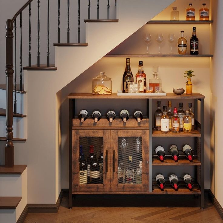 a wine rack with bottles and glasses on it in front of a stair case next to a set of stairs