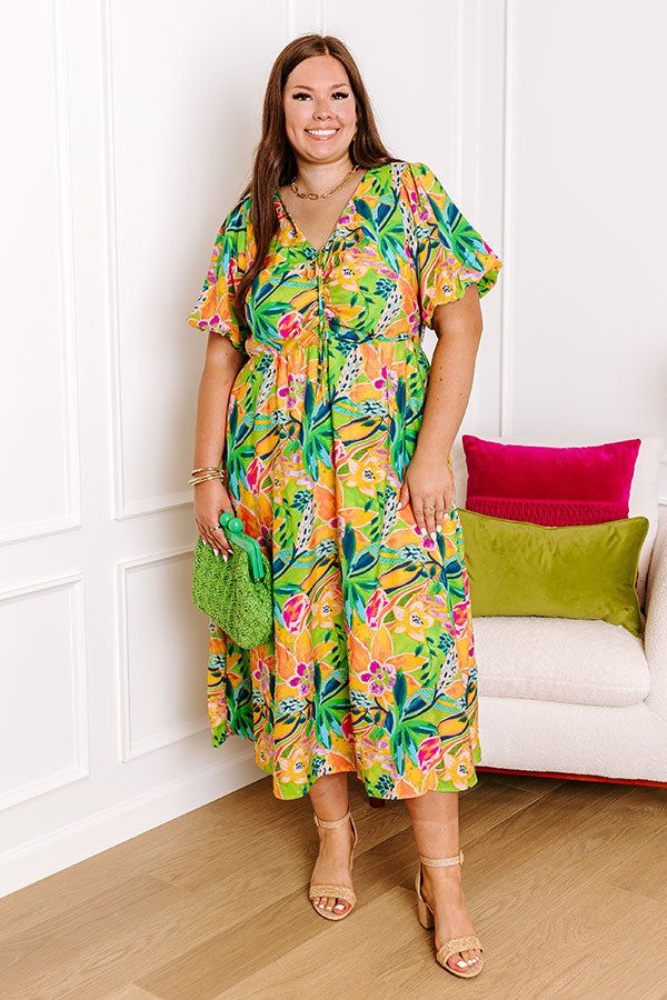 - Head to happy hour by the beach with this vibrant dress! - Lightweight material with a colorful abstract botanical print - A built-in partial lining ending - A v-cut neckline that goes down into a drawstring ruched bodice with a tie detail - Short puff sleeves with elastic cuffs - A waistline with an elastic back - Functional side pockets - A relaxed silhouette that ends in a straight hemline