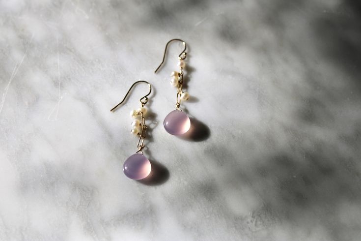 "Smooth plain chalcedony teardrops in the loveliest lavender-pink color, dangling from paperclip chain and accented with teeny tiny white freshwater pearls. Chain and ear wires are gold filled. Drop hangs 1.5\" below the earlobe." Hypoallergenic Pink 14k Gold Filled Jewelry, Hypoallergenic 14k Gold Filled Pink Jewelry, Pink Wire Wrapped 14k Gold-filled Jewelry, Pink 14k Gold-filled Wire Wrapped Earrings, Pink 14k Gold-filled Dangle Jewelry, Pink 14k Gold Filled Dangle Jewelry, Dainty Pink Drop Jewelry, Pink Teardrop 14k Gold Filled Jewelry, Pink Dainty 14k Gold Filled Earrings