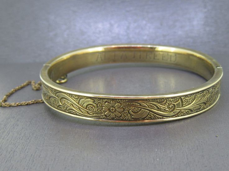 Gorgeous antique bangle bracelet. Signed gold filled.  Light wear to the finish, this is an antique piece so it has age related wear/patina.  Box clasp works great and has a safety chain.  Signed as you can see in the pictures and engraved with Alta M. Reed on the inside.  Visit Ribbons Edge for more great pieces of vintage and antique jewelry!  All items added to your cart at Ribbons Edge will automatically combine shipping. To stay up to date with my newest offerings, follow me on IG @ RibbonsEdge Jewelry Lookbook, Antique Gold, Antique Jewelry, Gold Filled, Bangle Bracelets, Jewelry Box, Jewelry Bracelets, Bangles, Bracelet