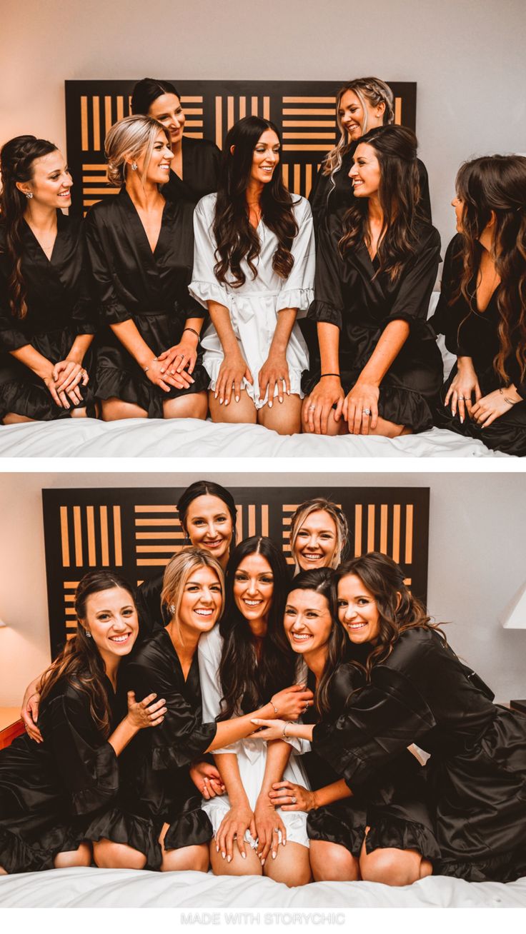 four women in black robes are sitting on a bed and one woman is smiling at the camera