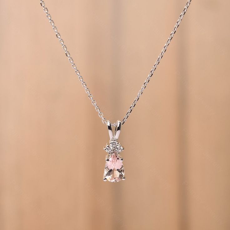 It is a natural pink morganite pendant, pear cut, measures 9x6 mm,about 1.27 carats The basic metal is sterling silver and plated with rhodium. To change the metal to a solid gold (white/rose) or platinum is also available, please ask for a quotation if you want. You can also go to my shop Home for more elegant rings:  https://www.etsy.com/shop/godjewelry?ref=hdr_shop_menu More alexandrite rings: https://www.etsy.com/shop/godjewelry?ref=seller-platform-mcnav&section_id=20715043 Customization is Dainty Pear-shaped White Gold Necklace, Morganite Teardrop Jewelry For Wedding, Morganite Teardrop Wedding Jewelry, Teardrop Morganite Wedding Jewelry, Pear-shaped Morganite Jewelry, Dainty Pear-shaped Cubic Zirconia Jewelry, Dainty Cubic Zirconia Pear-shaped Jewelry, Fine Jewelry Pink Teardrop Pendant, Pear-shaped Pink Diamond Jewelry