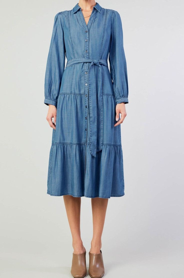 Elevate your style with our Chambray Button Down Tiered Skirt Dress. Featuring a collared neckline and self waist belt, this long sleeve midi dress exudes sophistication. The tiered skirt adds a touch of playfulness while the button down design gives a classic yet contemporary feel. Perfect for any elegant occasion. Material: 100% Lyocell Long Sleeve Kids, Chambray Dress, Sleeve Midi Dress, Long Sleeve Midi, Tier Skirt, Long Sleeve Midi Dress, Skirt Dress, Tiered Skirt, Kids Tops