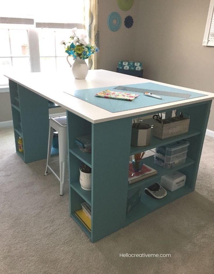 a kitchen island made out of an office desk with drawers and shelves on each side