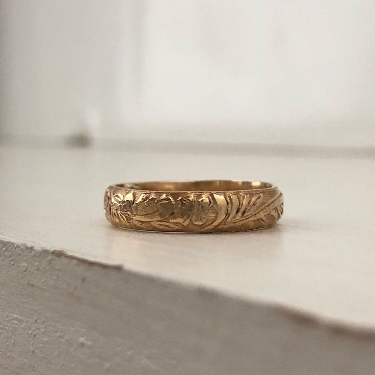 Our Cora Vintage Band is reminiscent of the old world wedding bands of the past. Its a perfect addition to your ring stack! Mix and match from our collection of simple to delicately detailed bands. All designed to look perfect worn together in whatever combination you choose to create! This ring is hand made in our studio at the time of order of 14kt gold filled metal wire, its 4mm wide. It is very durable and will wear very well with appropriate care, it will not change color or discolor your s Old World Wedding, Cool Piercings, Amethyst Ring Engagement, Antique Wedding Rings, Ring Stack, Gold Filled Ring, Gold Ring Stack, Gold Band Ring, Wide Band Rings