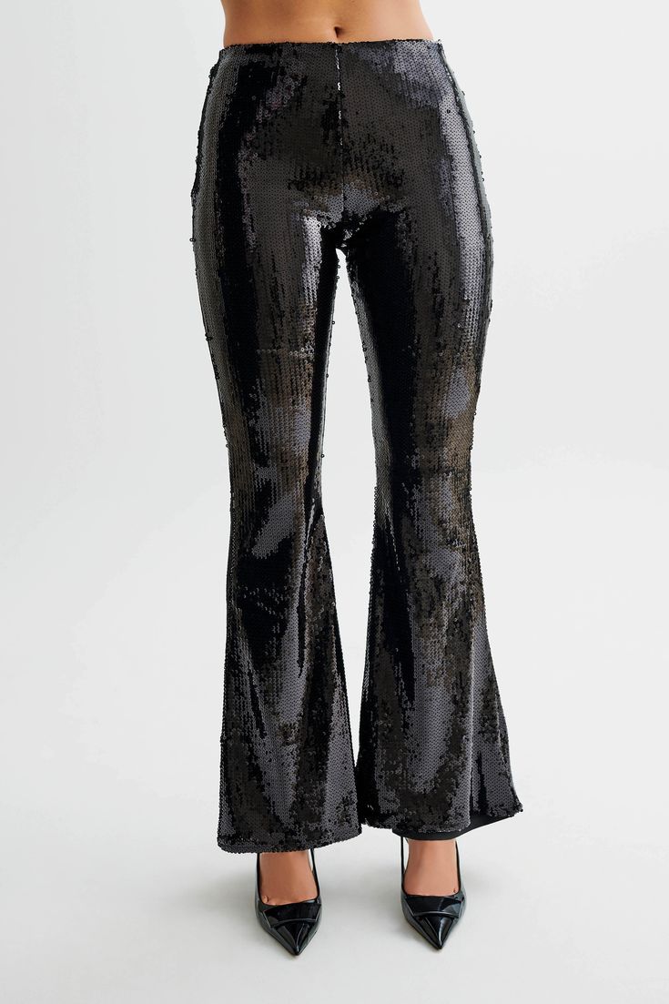 Zero disco ball required.The WILMA are a pair of sparkling wide-legged pants with a high waistline and flared hems. An invisible zipper closure at the side seam gives it a sleek, seamless silhouette. The legs transition into a flattering bootcut that complements its high, fitted waist. Lined sequinned fabrication adds a touch of comfortable glam, making these pants the perfect choice for all-night wear.