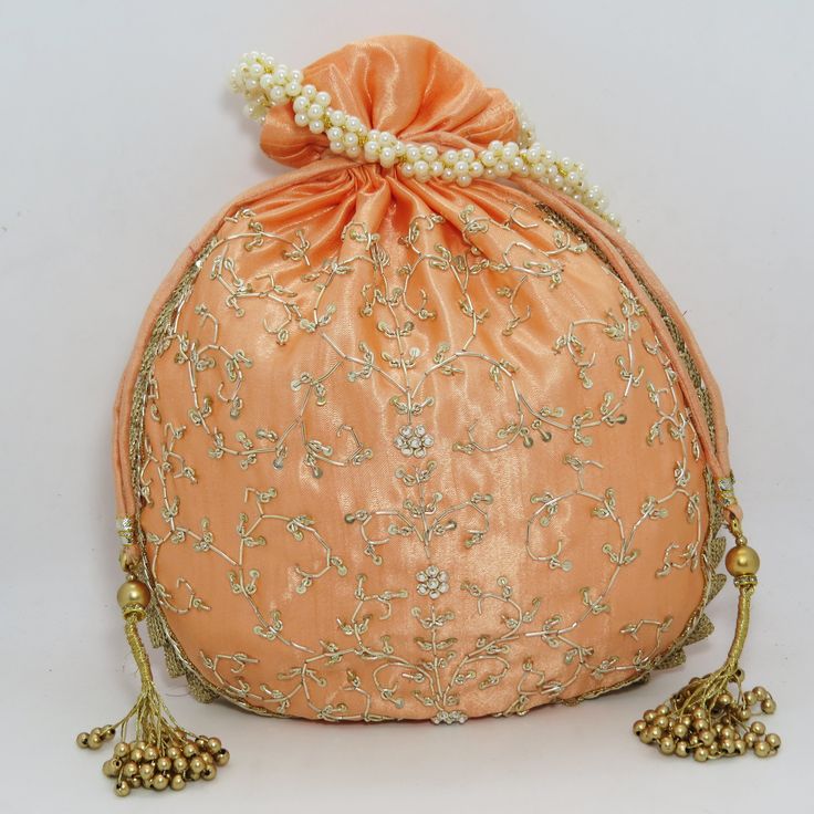 "traditional indian golden zardosi sequin embroider wedding giveaway bag potli | beautiful handmade gifting drawstring purse for woman Package Contents: 1 Size: 10\" x 8\" Designed with the heart, this beautiful Potli or batawa bag are eye catchy and made of premium material. Key Features: Zardosi embroidery art work. This potli is good match with both Indian and western outfits and are superb for wedding and festive parties. This would be best complement to your designer saree, lenhga or any ot Festive Gold Embroidery Potli Bag, Festive Potli Bag With Gold Embroidery, Gold Embroidered Potli Bag For Party And Festivals, Gold Embroidered Potli Bag For Festivals And Parties, Traditional Gold Embroidery Potli Bag, Gold Bollywood Bag With Handwork, Bollywood Style Gold Bag With Handwork, Gold Zari Work Bag For Diwali, Gold Bags With Zari Work For Diwali