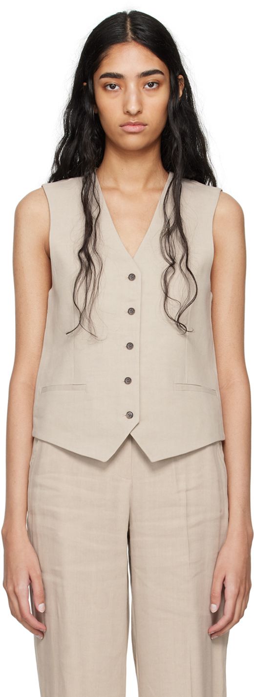 Stretch linen- and viscose-blend canvas vest. · V-neck · Button closure · Welt pockets · Partial satin lining Supplier color: Sand Tailored Spring Vest With Button Closure, Spring Linen Vest With Pockets, Tailored V-neck Vest With Pockets, Notch Lapel Vest With Buttons For Spring, Tailored Summer Vest With Buttons, Tailored Vest With Buttons For Summer, Summer Workwear Vest With Button Closure, Spring Workwear Linen Vest, Beige Button Closure Vest For Work