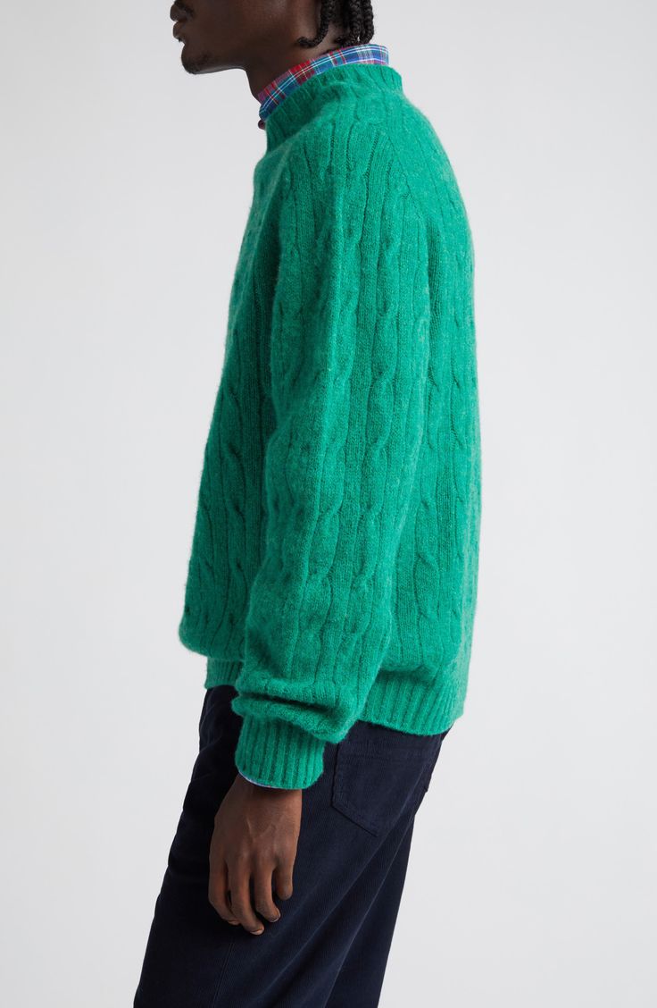 Brushed wool brings luxurious softness and comfort to a classic cable-knit sweater in a roomy fit that works layered or on its own. 26" length (size Medium) Crewneck Long sleeves Ribbed cuffs and hem 100% wool Dry clean Made in the UK Designer Clothing Green Cable Knit Turtleneck Sweater, Fall Mohair Cable Knit Sweater, Classic Green Textured Knit Sweater, Classic Green Cable Knit Sweater, Cozy Cable Knit Merino Wool Sweater, Cozy Mohair Sweater With Cable Knit, Cozy Mohair Cable Knit Sweater, Green Wool Sweater With Textured Knit, Green Wool Textured Knit Sweater