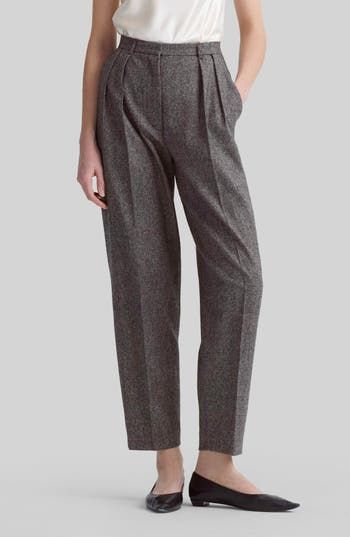 Tailored from rich wool tweed, these tapered-leg pants feature reversed front pleats that create a relaxed fit. 27" inseam; 15" leg opening; 12 1/2" front rise; 17" back rise (size 40FR) Zip fly with hook-and-bar closure Front slant pockets; back button-welt pockets 100% wool Dry clean Made in Italy Designer Clothing Tweed Bottoms With Pockets For Work, Tailored Tweed Pants For Fall, Chic Tweed Pants For Workwear, Elegant Tweed Pants For Business, Elegant Tweed Bottoms For Business, Tailored Tweed Fall Bottoms, Tailored Tweed Bottoms For Fall, Tweed Bottoms For Workwear In Fall, Formal Tweed Pants For Fall