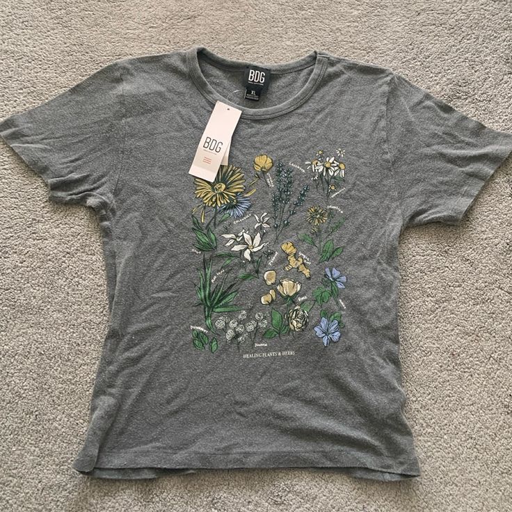 Super Cute Urban Outfitters Baby Tee With Floral Design! The Fabric Gives It A Laidback Feel And Look! Sells For $35 But Here Its $15! Urban Outfitters Relaxed Fit T-shirt For Spring, Trendy Spring Tops With Plant Print, Trendy Tops With Plant Print For Spring, Trendy Plant Print Tops For Spring, Casual Fitted Floral Print T-shirt, Fitted Floral Print Casual T-shirt, Urban Outfitters Fitted Floral Print Tops, Cute Cotton Tops With Floral Print, Fitted Urban Outfitters Floral Print Tops