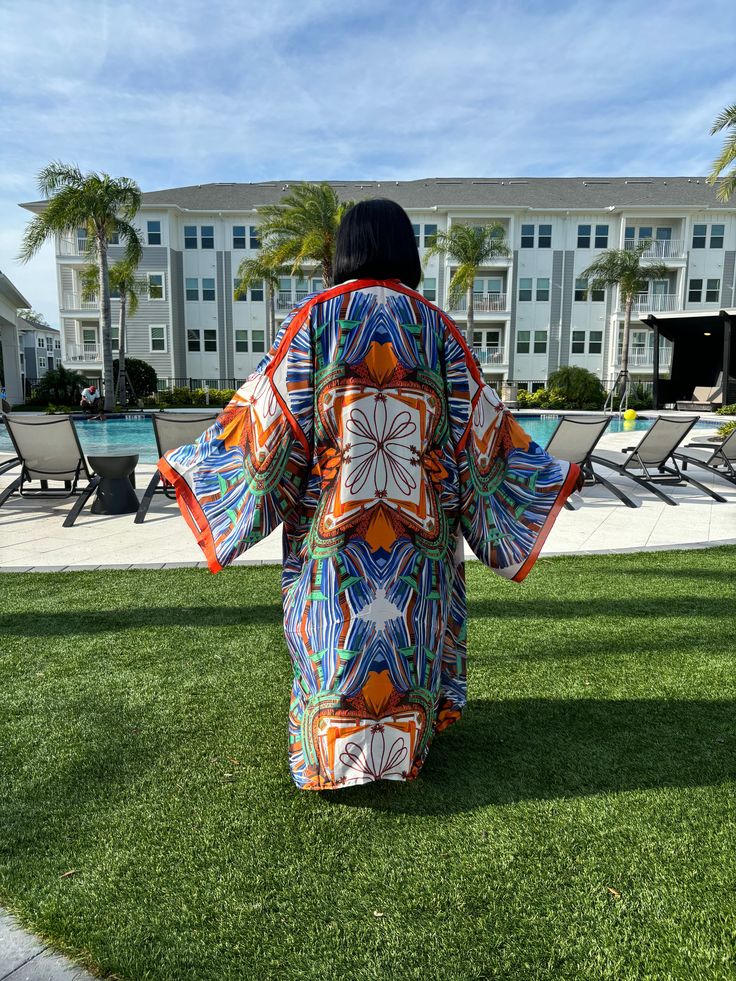 Alluring statement piece Caftan is one size fits most Fits up to size 3x Soft and silky material Multicolor Open Front Kaftan For Beach, Long Sleeve Kimono For Vacation, One Size Long Sleeve Kaftan For Vacation, Flowy Multicolor Kimono For Vacation, Long Sleeve Multicolor Kaftan For Vacation, Oversized Open Front Festival Kaftan, Orange Kimono For Vacation With Kimono Sleeves, Oversized Kaftan With Kimono Sleeves For Festival, Casual Silk Kaftan For The Beach