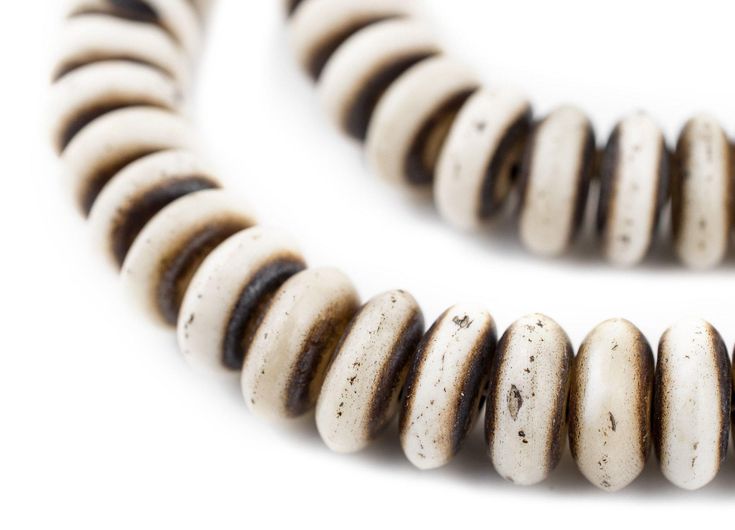 We are loving the beautiful rustic style of these Grey Bone Disk Mala Prayer Beads. These traditional Bone Mala beads are handcrafted in Nepal. Every strand comes with 108 beads and they can be used as Prayer Beads. Each strand also comes with 3 beautiful orange tassels. Every Mala is about 29" in length. Each bead is approximately 6 x 14mm with a roughly 2mm hole. Take home this treasure today!