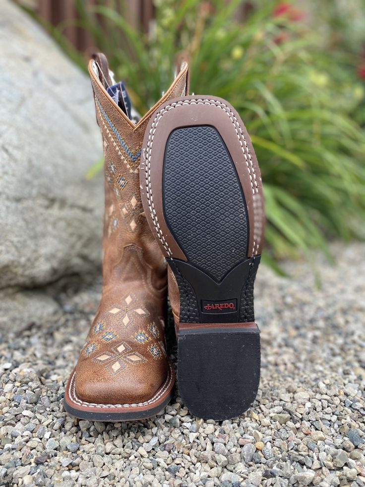 The Laredo Jossie has an intricate embroidered design in soft colors from the top to the outsole and from the toe to the heel. The Jossie is an attention getter. Features broad square toe, Cowboy Approved II outsole and a removable orthotic insole. The leather is soft and warm. The design is beautiful. Take Jossie for a horseback ride or a night on the town! Foot: Leather Height: 11 inch shaft height Insole: Cushion Comfort Insole Outsole: Cowboy Approved II Toe: Broad Square Heel: Stockman Square Toe Cowgirl Boots, Height Insoles, Tan Square, Cowgirl Boots Square Toed, Cowgirl Outfit, Western Store, Leather Western Boots, Horseback Riding, Cowgirl Boots