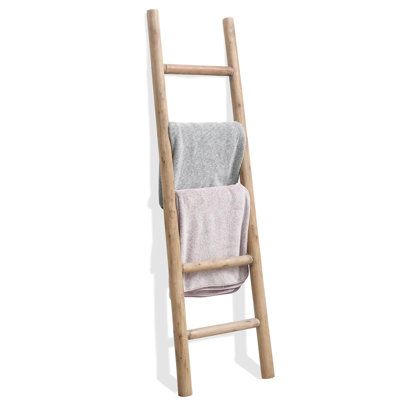 a wooden ladder with two towels hanging from it's sides, against a white background