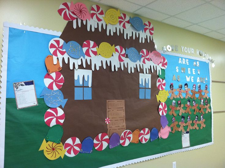 a bulletin board decorated with candy land and lollipops on the front wall