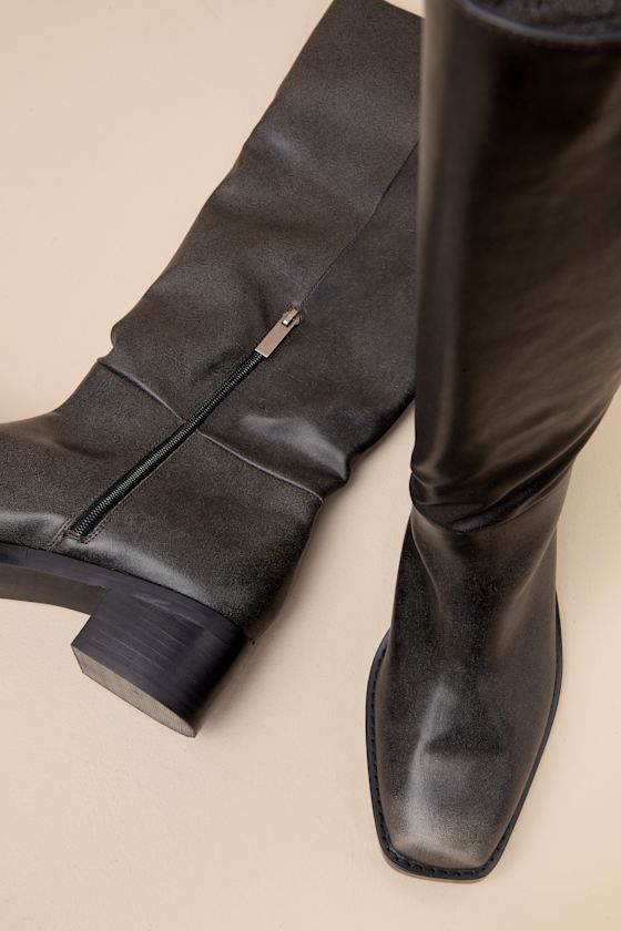 Versatile and chic, the Lulus Maylone Black Distressed Knee-High Boots are ready for anything this season! Trendy, distressed detailing accents smooth faux leather as it shapes these must-have boots with a squared upper that rises to a 14.5"" knee-high shaft with a 15"" circumference. A 7"" zipper at the instep makes for easy on-and-off, while a chunky block heel completes the look! Please note: These boots are intentionally designed to include pre-worn distressing for a trendy lived-in look. &n Elegant Workwear Moto Boots With Leather Lining, Wide Calf Faux Leather Ankle Boots, Sleek Knee-high Faux Leather Boots, Elegant Leather Moto Boots With Pointed Toe, Sleek Leather-lined Knee-high Boots For Fall, Chic Leather-sole Knee-high Boots, Chic Knee-high Boots With Leather Sole, Sleek Knee-high Boots With Leather Lining For Fall, Sleek Fall Knee-high Boots With Leather Lining