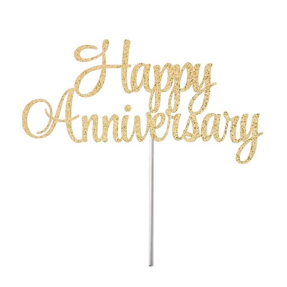 happy anniversary cake topper on a stick with the words happy anniversary written in gold glitter