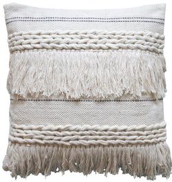 a white pillow with fringes on it