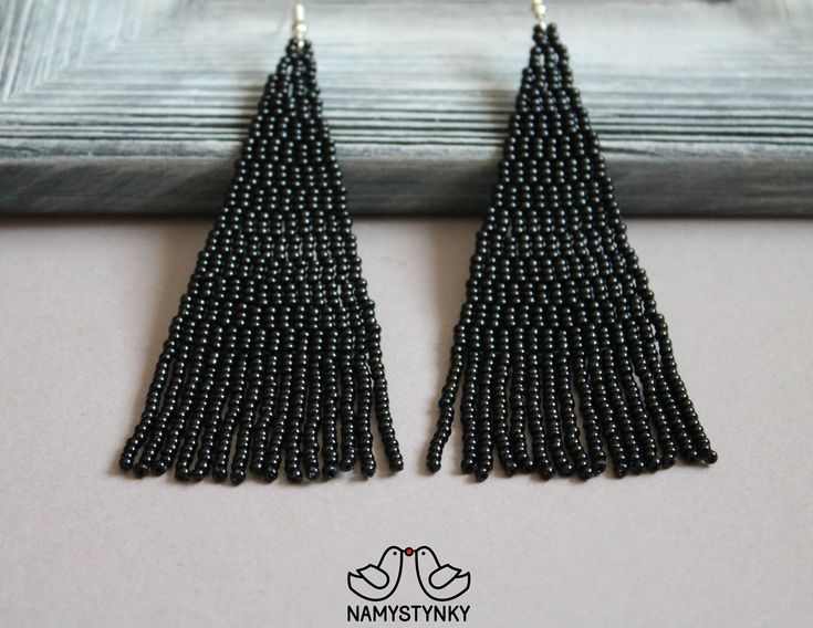 These black beaded earrings are made of high-quality Czech beads and strong synthetic thread. They are elegant, fashionable, and highly versatile, suitable for everyday wear. Features: Sterling silver components Color: white Length (approximate): 9 cm (3.5 in) This item is currently in stock. More beaded earrings http://etsy.me/2ycItdb Gerdan necklaces http://etsy.me/2mihf0J Beaded necklaces http://etsy.me/2Dkf1Fo Crochet necklaces http://etsy.me/2CAPdFc Back to shop https://www.etsy.com/shop/Na Black Beaded Drop Earrings, Black Beaded Earrings With Dangling Beads For Evening, Black Beaded Dangling Earrings For Evening, Black Dangling Beads Earrings For Evening, Elegant Black Beaded Drop Earrings, Elegant Black Dangle Beaded Earrings, Black Beaded Fringe Earrings With Round Beads, Black Beaded Earrings With Round Beads And Fringe, Black Beaded Fringe Earrings As Gift