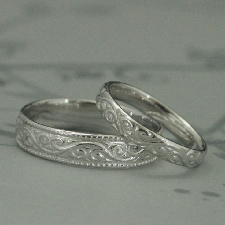 This is a wonderfully lovely set for a wonderfully lovely couple! It features a vintage style design with a modern twist to it. Cast in solid 14K gold, it features a swirling design around the entire outer surface. The wider band measures 5.5mm wide by 1.5mm thick. It features a lovely milgrain edge. The thinner band measures 3.5mm wide by 1.5mm thick and features the matching design without the edge. These are quality solid gold rings to last you a lifetime and then some! Your rings can be cast Yellow Gold Wedding Ring With Elegant Design, White Gold Wedding Jewelry With Classic Design, Yellow Gold Bridal Sets For Wedding With Elegant Design, Classic Design White Gold Wedding Jewelry, Classic White Gold Wedding Jewelry, Elegant Yellow Gold Bridal Sets For Wedding, Elegant White Gold Couple Wedding Rings, Elegant Formal Engraved Couple Rings, White Gold Rings With Classic Design For Wedding