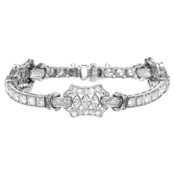 This diamond & platinum Bracelet with a refreshing and delicate Art deco Geometric design. This vintage Deco is Expertly crafted in solid Platinum, Featuring. (9) Genuine Diamonds Marquise cut, bezel-set,  (20) Genuine Medium Diamonds round-cut & (66) Genuine Small Diamonds weighing approx.   3.50 carats in total  (G-H  & VS  Clarity) Total Approx. Diamond weight: carats The Diamonds radiate brilliance and sparkle; the complete piece weighs 22.1 grams and has a total length of 6” x 4 to 11 mm (w Silver Brilliant Cut Diamond Bracelet In Art Deco Style, Art Deco Diamond Bracelet With Accents, Silver Art Deco Diamond Bracelet, Art Deco Platinum Diamond Cut Bracelet, Vintage Diamond Bracelet, Luxury Art Deco Diamond Bracelet, Marquise Jewelry, Platinum Bracelet, Art Deco Geometric