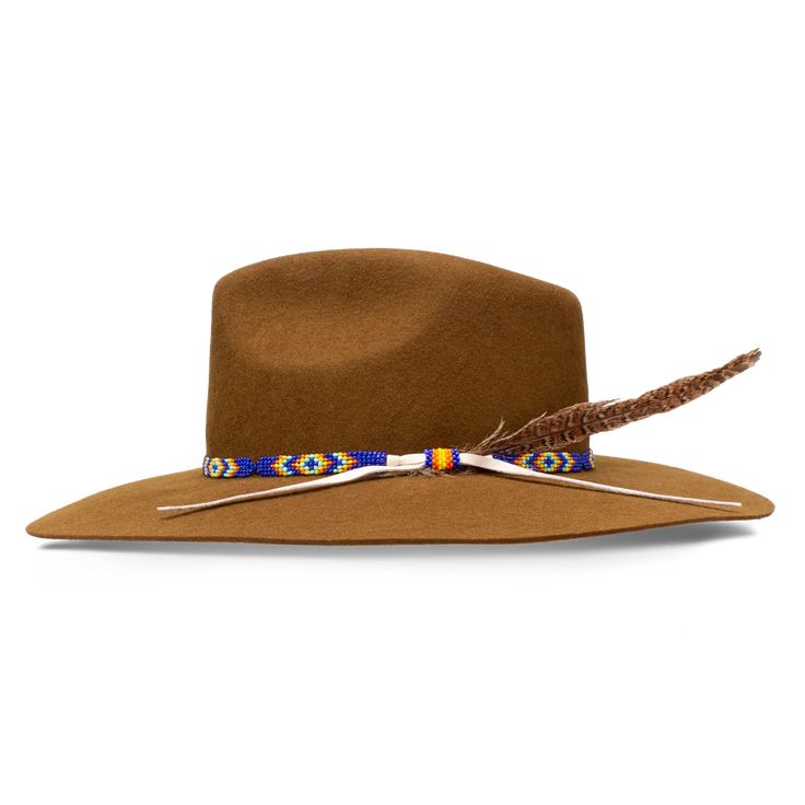 Charlie 1 Horse CWGYPS-403611 Gypsy Acorn Wool Hat Imbued with a wanderer’s soul and made for the open road, the Gypsy in Acorn is a delightful wool hat with a 3 3/4" pinch-front crown and a 3 3/4" floppy downturned brim. The beaded hatband features a classic Native-American-inspired pattern in blues, reds, and golds, with a lone feather tucked in for good measure. An off-center Charlie 1 Horse brand logo on the crown signals the hat’s point of origin. Part of our Wanted Collection, the Gypsy wa Resistol Hats, Charlie 1 Horse Hat, Twisted X Shoes, Horse Brand, Dan Post Boots, Work Pants Women, Hey Dudes, Boot Accessories, Open Road