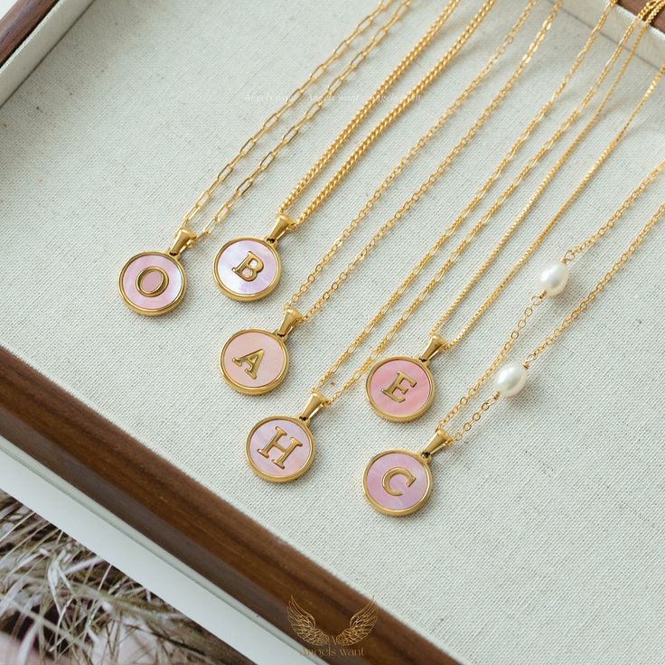 Introducing our Personalized gold-Filled pink mother of Pearl Initial Necklace. These stunning pieces combine the timeless elegance of mother of pearl with the personal touch of a customizable initial pendant. Plus, you can choose from six versatile chain options to suit your style and preferences.These wonderful pieces of jewelry will make a sweet, thoughtful, and precious gift for yourself or that special someone. Product Details Chain: -Gold-filled Curb Chain   Width: 2mm -Gold-filled Box Cha Gift Pearl Charm Initial Pendant Necklace, Gift Pearl Charm Initial Pendant Necklaces, Pink Initial Pendant Jewelry For Mother's Day, Elegant Pink Initial Pendant Necklaces, Elegant Personalized Pink Charm Necklace, Initial Necklace With Pearl Pendant For Gift, Initial Pendant Necklace With Pearl For Gift, Pink Initial Pendant Necklace For Gift, Pink Initial Pendant Necklace As Gift