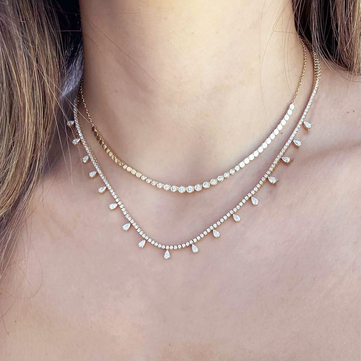 This exquisite Graduated Bezel Diamond and Gold Disc Chain Choker Necklace is designed to be a statement of sophistication and elegance. Crafted in 14K solid gold, this choker features a stunning arrangement of graduated bezel-set diamonds that are beautifully complemented by polished gold discs. The diamonds gently increase in size as they cascade along the necklace, creating a mesmerizing focal point that highlights the neckline.✪ FEATURES: • Crafted with premium 14K gold, ensuring durability Gold Disc, Bezel Set Diamond, Diamonds And Gold, Chain Choker Necklace, Bezel Diamond, Chain Choker, Necklace For Women, Bezel Setting, Focal Point