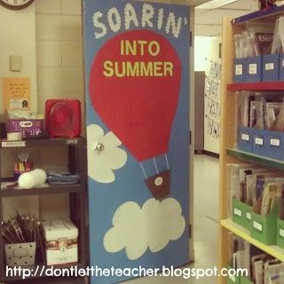 a classroom door decorated to look like a hot air balloon with the words soarin'into summer written on it