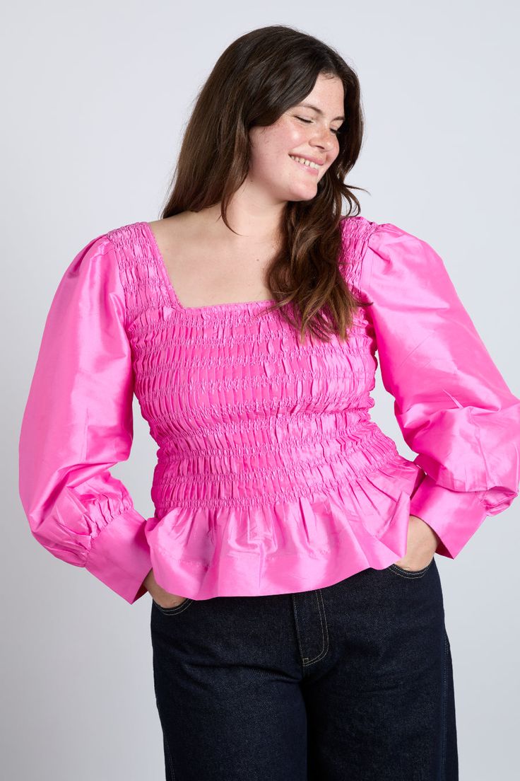 Our pink Ariana blouse boasts puff sleeves, a shirred bust and feminine bow details. •Shirred bodice •Long puff sleeves •Back bow detail •Select your normal size •100% Recycled Polyester •Designed in London MODEL INFO: Model is 1 is 5'10.5 and is wearing a UK 10. Model is 2 is 5'9 and is wearing a UK 16. Chic Pink Puff Sleeve Top With Gathered Sleeves, Chic Pink Puff Sleeve Top With Square Neck, Pink Balloon Sleeve Blouse With Ruffles, Pink Ruffled Square Neck Top, Pink Square Neck Top With Ruffles, Chic Pink Blouse With Gathered Sleeves, Pink Puff Sleeve Top With Gathered Sleeves, Pink Tops With Puff Gathered Sleeves, Chic Pink Smocked Top With Puff Sleeves