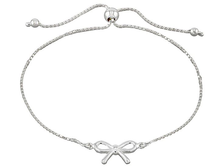 Sterling Silver Bow Bolo Bracelet. Measures approximately 5/16 of an inch in width and has an adjustable slide closure. Trendy Silver Jewelry With Sliding Knot, Casual Silver Adjustable Chain Bracelet, Casual Adjustable Chain Bracelet, Trendy Silver Bracelet With Sliding Knot, Trendy Silver Adjustable Bracelet, Adjustable Metal Bracelet For Formal Occasions, Elegant Bracelets With Adjustable Band As Gift, Elegant Bracelets With Adjustable Band For Gift, Elegant Silver Bracelet With Sliding Knot