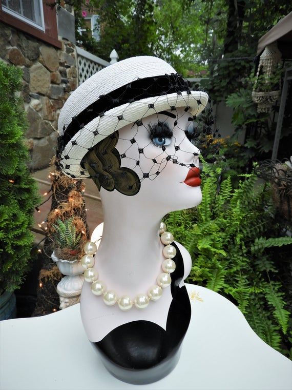 LOVELY Classy Vtg 1940's Ladies White & Black Velvet Ribbon Woven Veiled Bumper Hat sz 21" DiameterThis is such a fun vintage Bumper hat from the 1940's.  It's in just impeccable condition with no flaws I could note what so ever.  The hat is a bright white woven fabric which feel synthetic to me.  It has a short little brim which tilts up slightly at the sides with a gorgeous black veil attached to the front of the hat. There's a beautiful black velvet ribbon round the crown of the hat with a sl Vintage Adjustable Hat Bands For Kentucky Derby, Victorian Adjustable Hats For Vintage Events, Victorian Style Adjustable Hats For Vintage Events, Retro Kentucky Derby Vintage Hat, Vintage Flat Brim Costume Hats And Headpieces, Vintage Mini Hat With Flat Brim For Kentucky Derby, Vintage Mini Hat For Vintage Events With Short Brim, Fitted Vintage Cloche Hat For Vintage Events, Vintage Fitted Hat Bands For Party