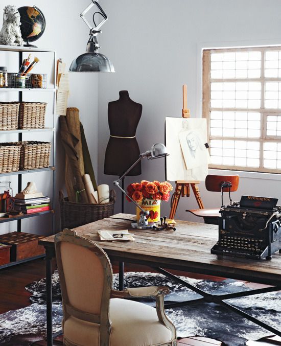 a living room filled with furniture and lots of clutter on top of a table