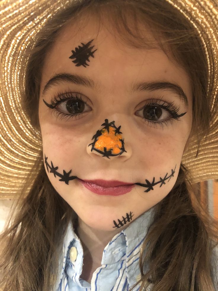 Black eyeliner, lipstick and a little orange paint made this little girl super happy for scarecrow day! Kids Scarecrow Face Paint, Simple Face Painting For Halloween, Toddler Scarecrow Makeup, Easy Face Paint Ideas For Halloween, Face Painting For Halloween For Kids, Halloween Face Painting Simple, Easy Scarecrow Face Paint, Face Painting Ideas For Fall Festival, Kid Scarecrow Makeup