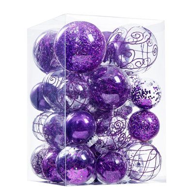 purple and white ornaments in a clear box