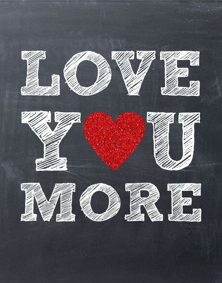 i love you more written on a chalkboard with a red heart in the middle