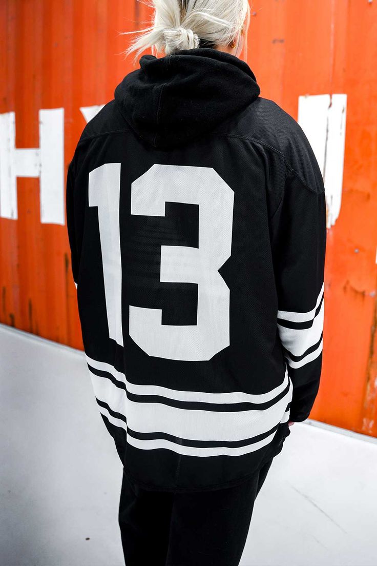 The Born Dead Hockey Jersey is made of a polyester mesh jersey material. The designs consist of the number thirteen, Born Dead text logo, full and a globe. Perfect to wear over a hoodie and to complete the look of a hockey jersey. The designs are printed. • 100% recycled polyester fabric • Fabric weight: 4.7 oz./yd.² (160 g/m²)• Two-way stretch fabric• Moisture-wicking material• Relaxed fit This item is Made to Order. Size guide CHEST (inches) WAIST (inches) HIPS (inches) 2XS 34 ⅝ 28 ⅜ 35 ⅜ XS 3 Black Varsity Jersey For Streetwear, Black Jersey With Letter Print For Streetwear, Black Letter Print Jersey For Streetwear, Sporty Long Sleeve Jersey With Letter Print, Number Print Tops For Sports Season Streetwear, Collegiate Style Jersey With Letter Print For Streetwear, Collegiate Letter Print Jersey For Streetwear, Sporty Black Long Sleeve Jersey, Black Long Sleeve Sporty Jersey