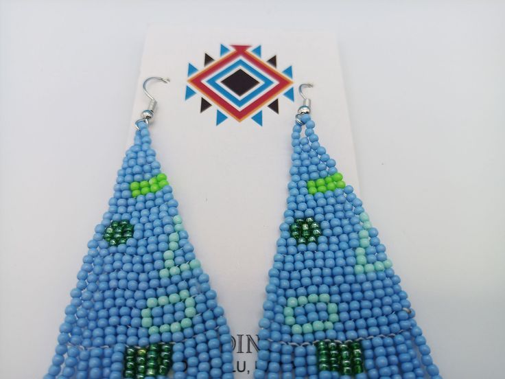 Amazing Turquoise Color Modern Powwow Native American Style Seed Bead Earrings with a variety of native colors in a non-traditional design. Stainless steel ear wires and genuine high quality beads. A beautiful combination of colors and native design at a super price. All handmade. Shipped Free Unique Blue Beaded Earrings For Festivals, Southwestern Style Blue Festival Earrings, Southwestern Style Blue Earrings For Festivals, Southwestern Blue Beaded Earrings With Round Beads, Blue Teardrop Beaded Earrings For Festival, Handmade Southwestern Blue Beaded Earrings, Traditional Blue Beaded Earrings, Traditional Turquoise Teardrop Beaded Earrings, Southwestern Style Green Earrings With Colorful Beads