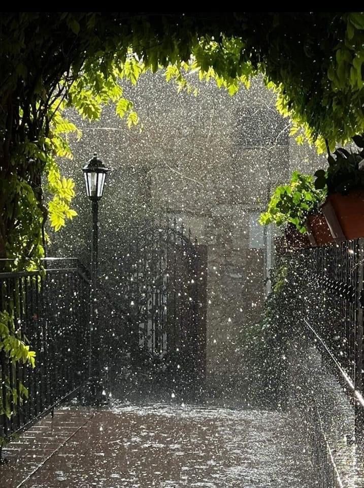 an open umbrella on a rainy day in the rain