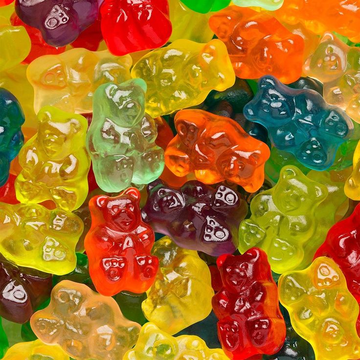 many different colored gummy bears are stacked on top of each other in the same pattern