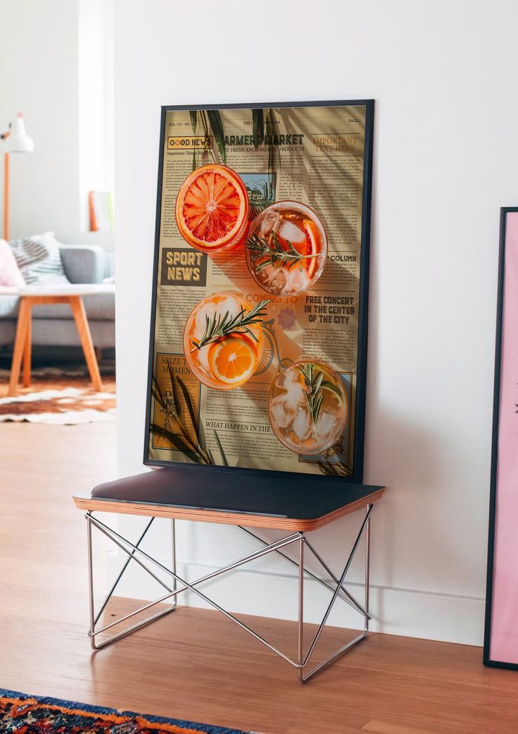 an orange slice sitting on top of a wooden bench next to a wall mounted poster