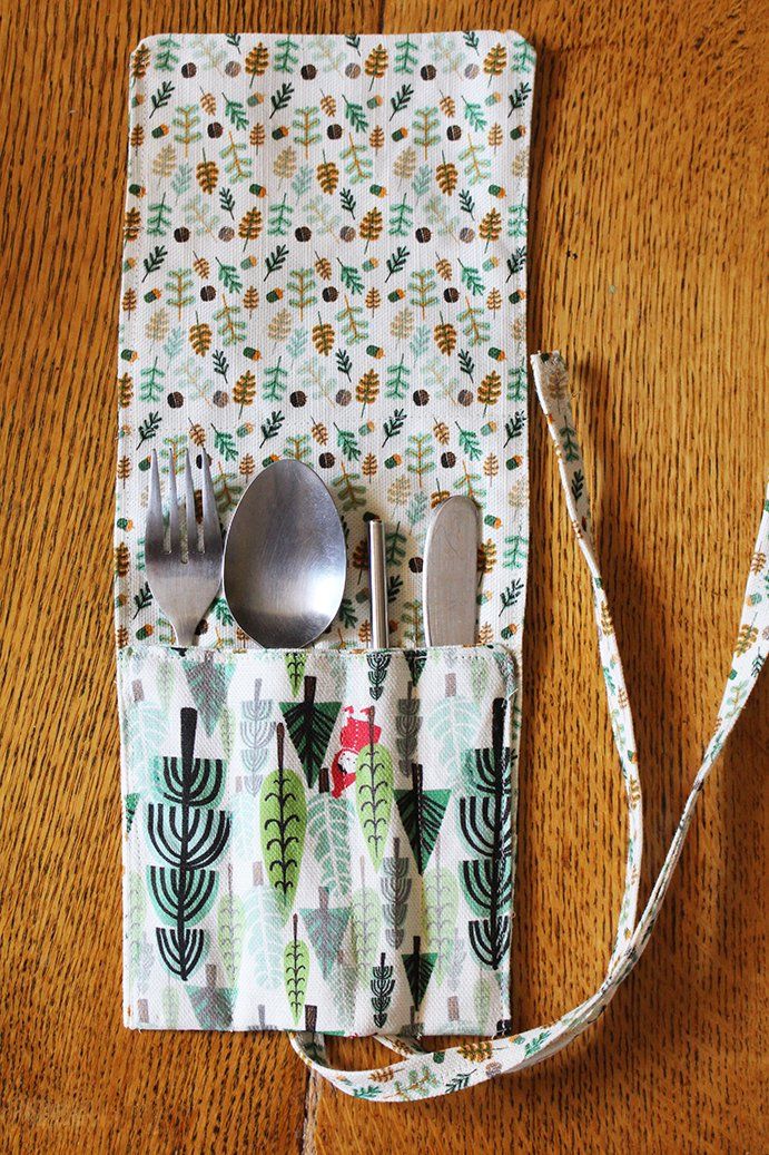 the utensils are wrapped in fabric and ready to be used as placemats